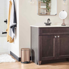 6L semi-round pedal bin - rose gold finish - lifestyle in bathroom next to cabinet