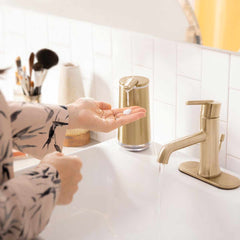 foam sensor pump - brass finish - lifestyle hand using pump in bathroom