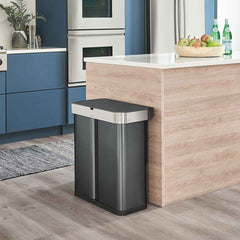 58L dual compartment rectangular sensor bin with voice and motion control - black finish - lifestyle in kitchen next to island image
